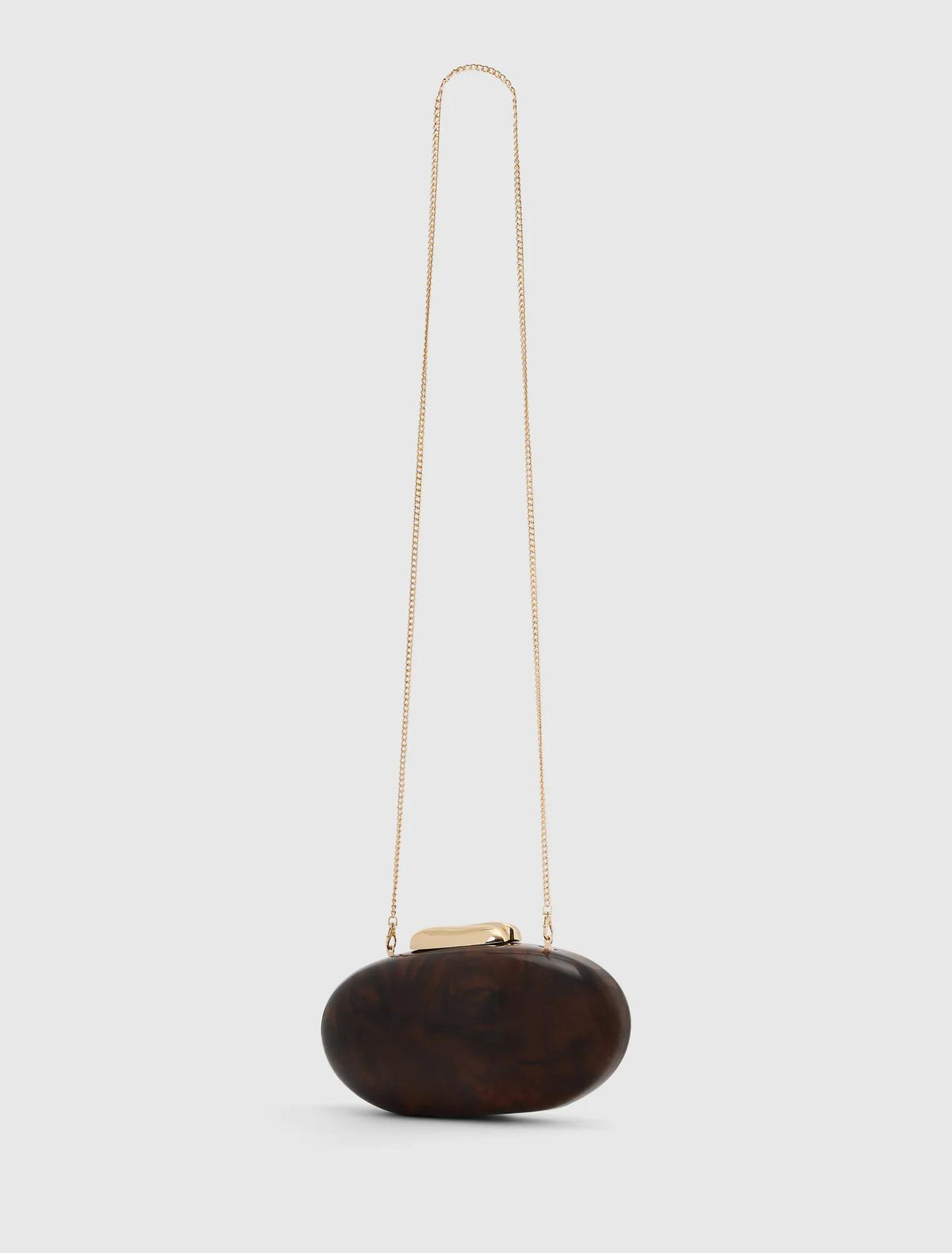 Peyton Oval Hardcase Clutch Tortoise_mannequin